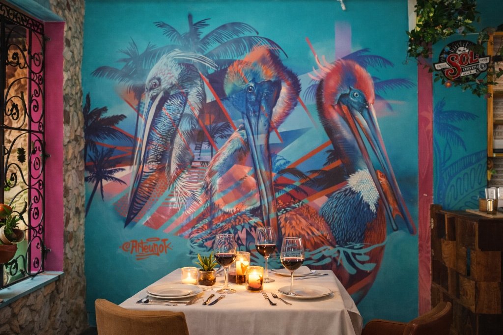 Pelican mural in restaurant setting — ArteUnoK